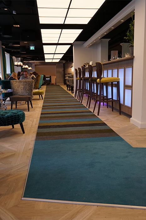 multi-coloured-carpet-creating-pathway-through-restaurant  