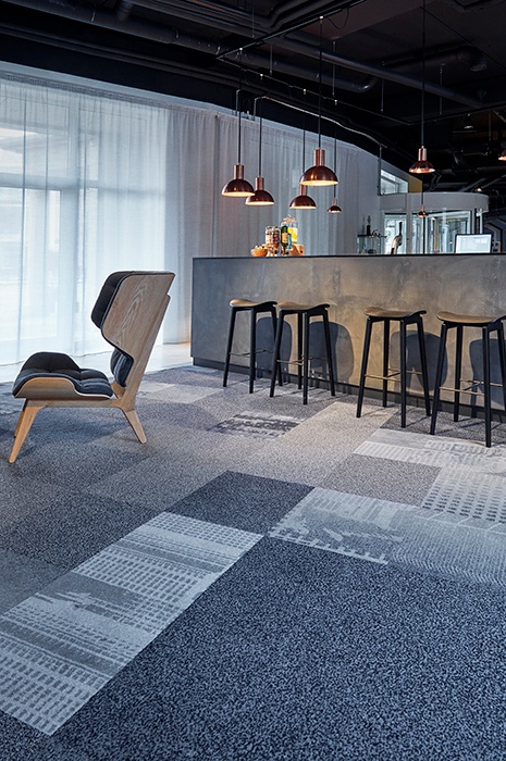 Classy bar, with simple furniture and rugged carpet tiles for flooring Classy bar, with simple furniture and rugged carpet tiles for flooring