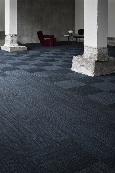 Carpet tiles in shades of blue from ege's Highline concept used in checkered and striped patterns 