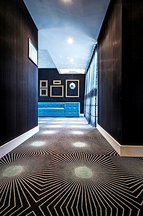 Geometric wall-to-wall carpet by ege, showcasing how carpet design can be used to create optical iIllusions