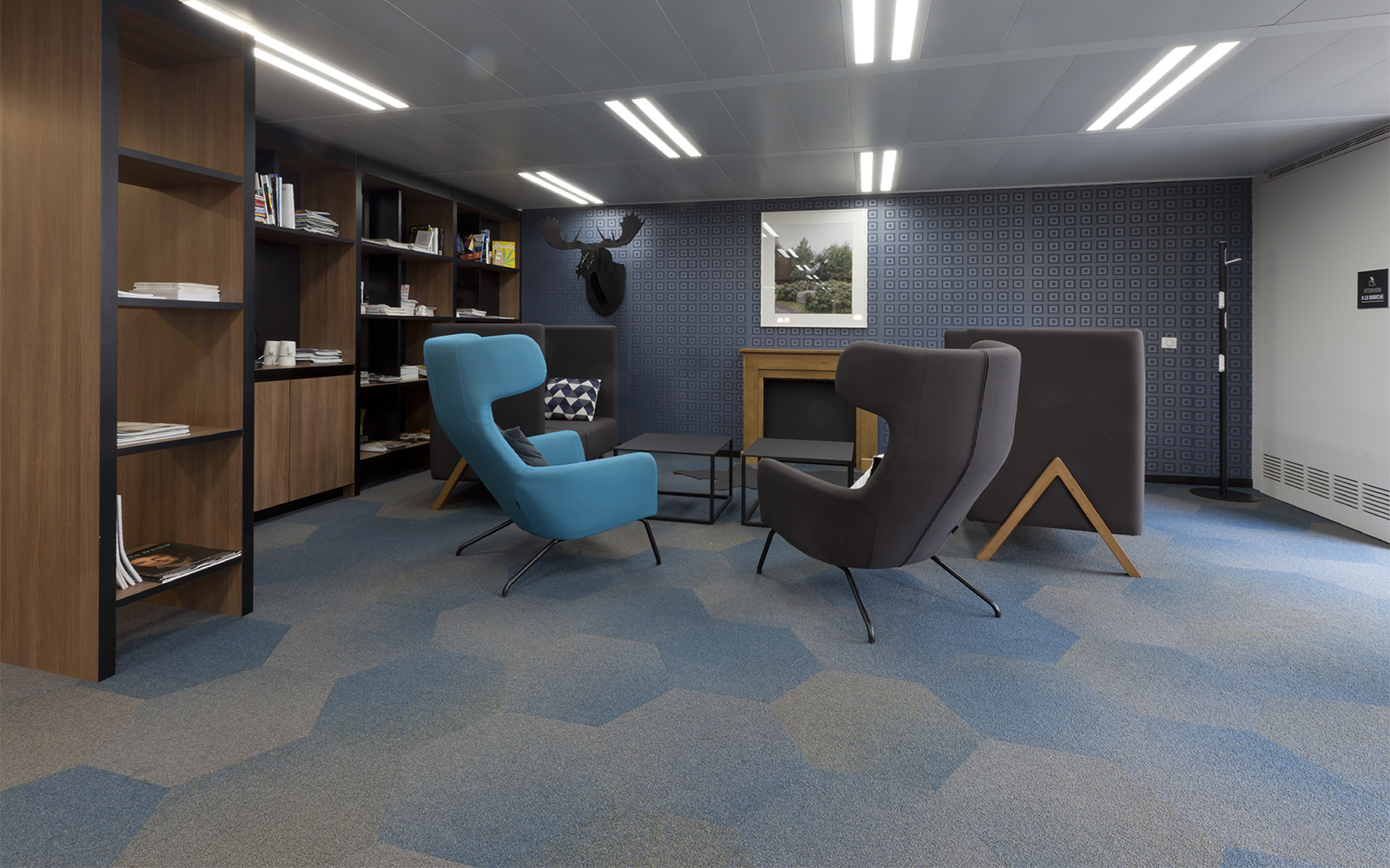 faded blue and beige hexagon carpet tiles by ege in an office setting 